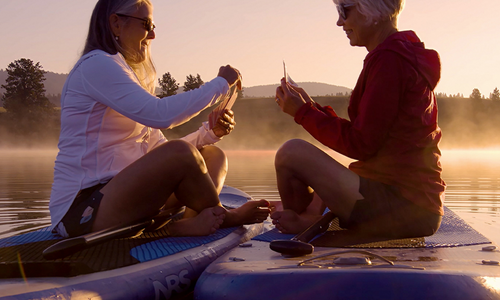 two ladies on paddle board