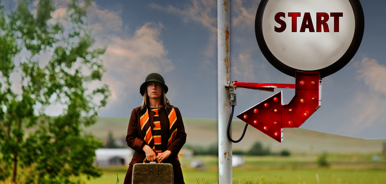 lady with suitcase standing by sign