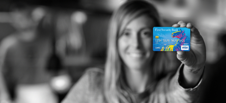 Girl holding debit card